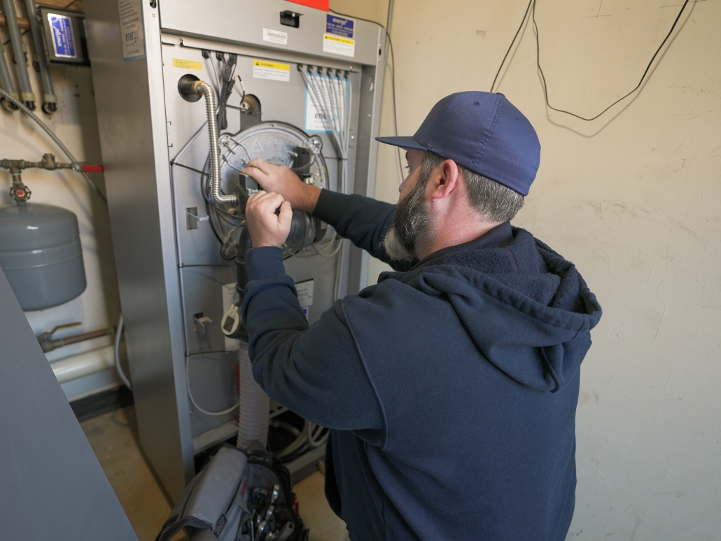Energo boiler technician performing annual inspection