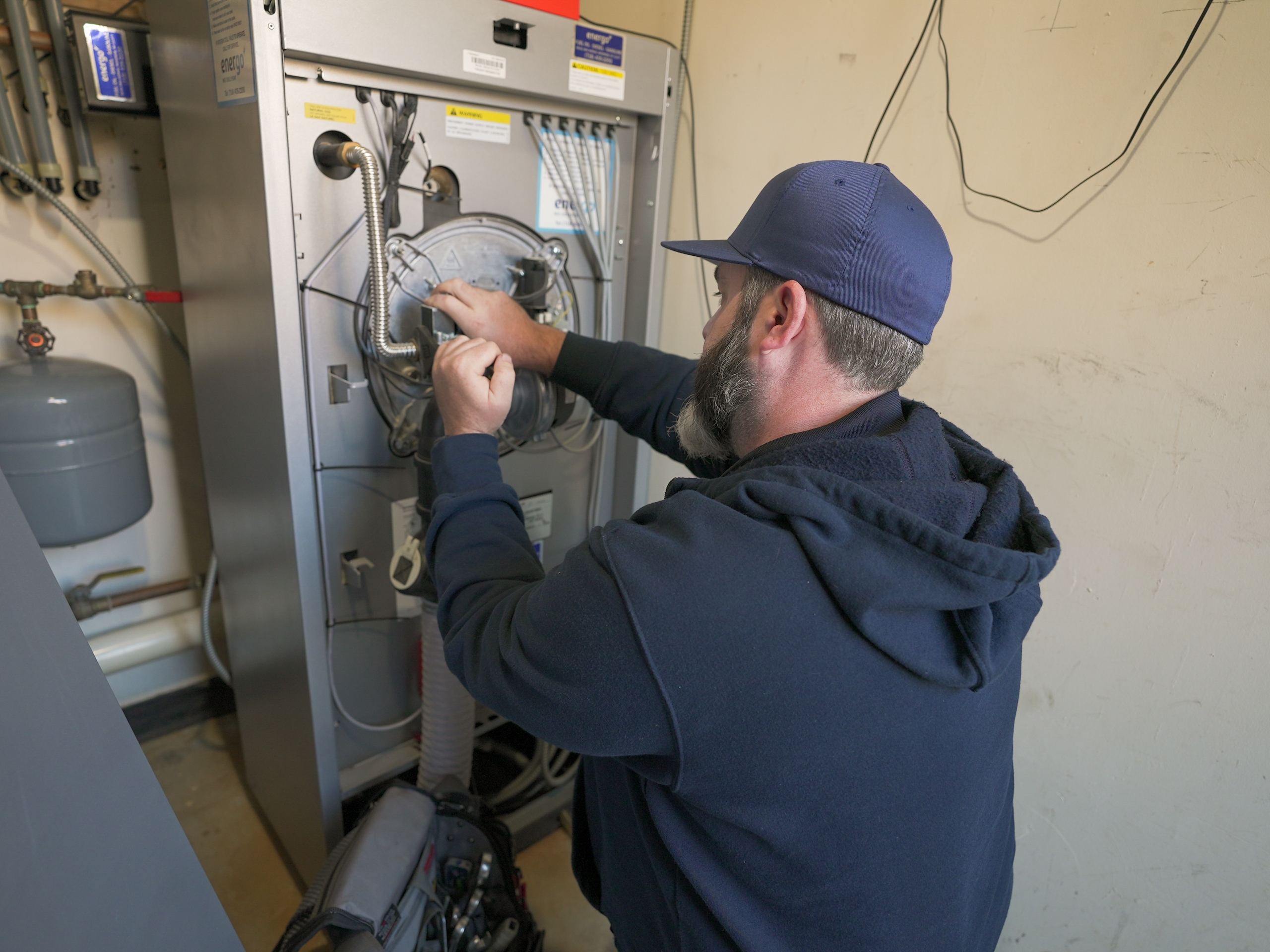 Energo boiler technician performing annual inspection