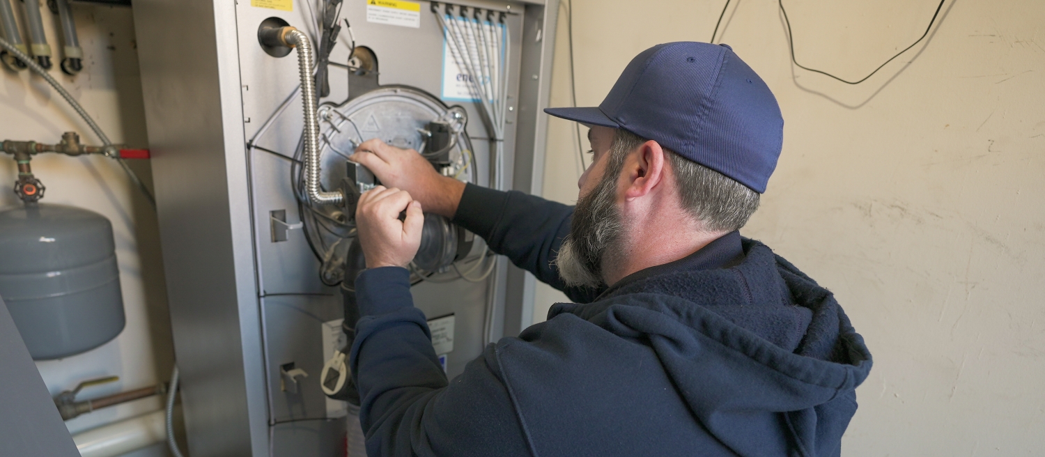 Energo technician conducting commercial boiler repair
