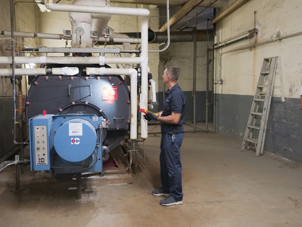 Energo technician servicing a large boiler system in NYC