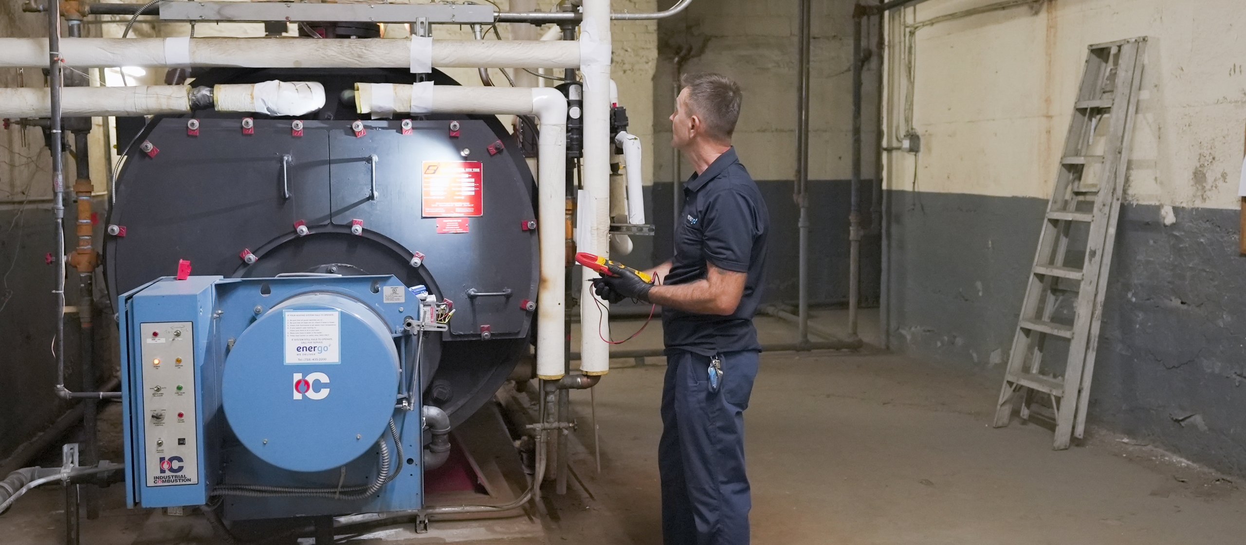 Energo service technician performing boiler safety checks