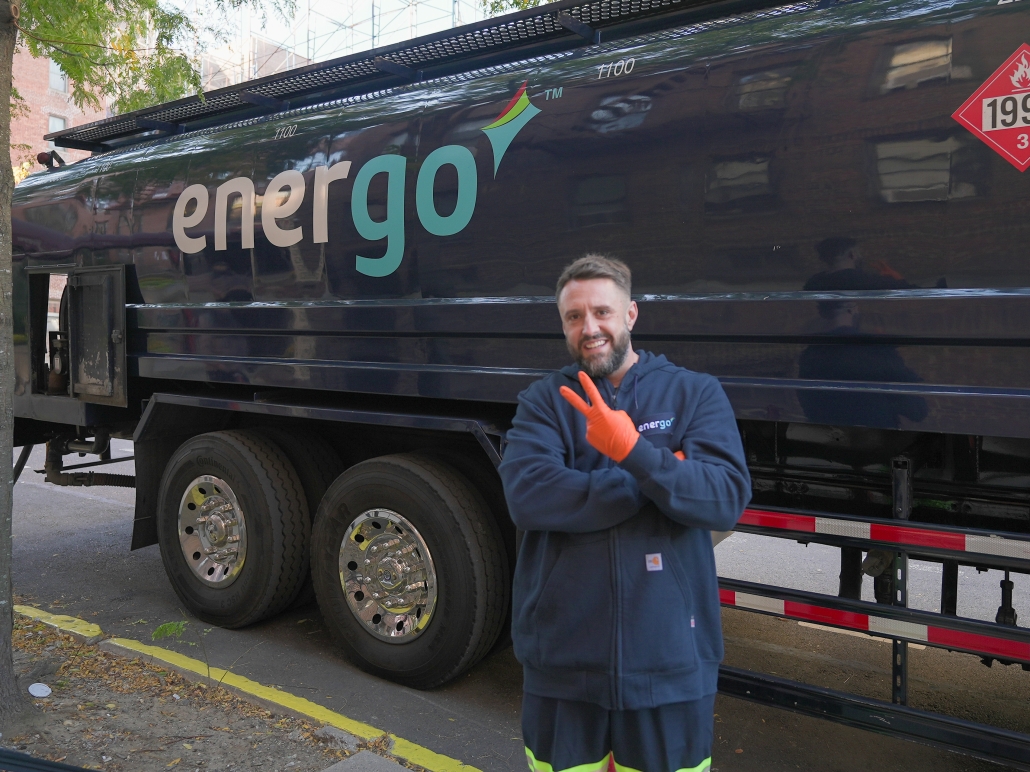 Energo heating oil delivery truck with technician standing in front