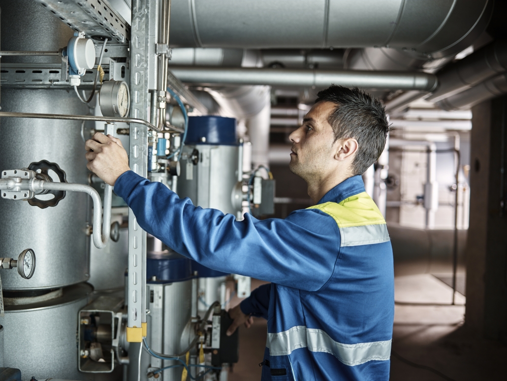 Energo technician adjusting commercial HVAC system