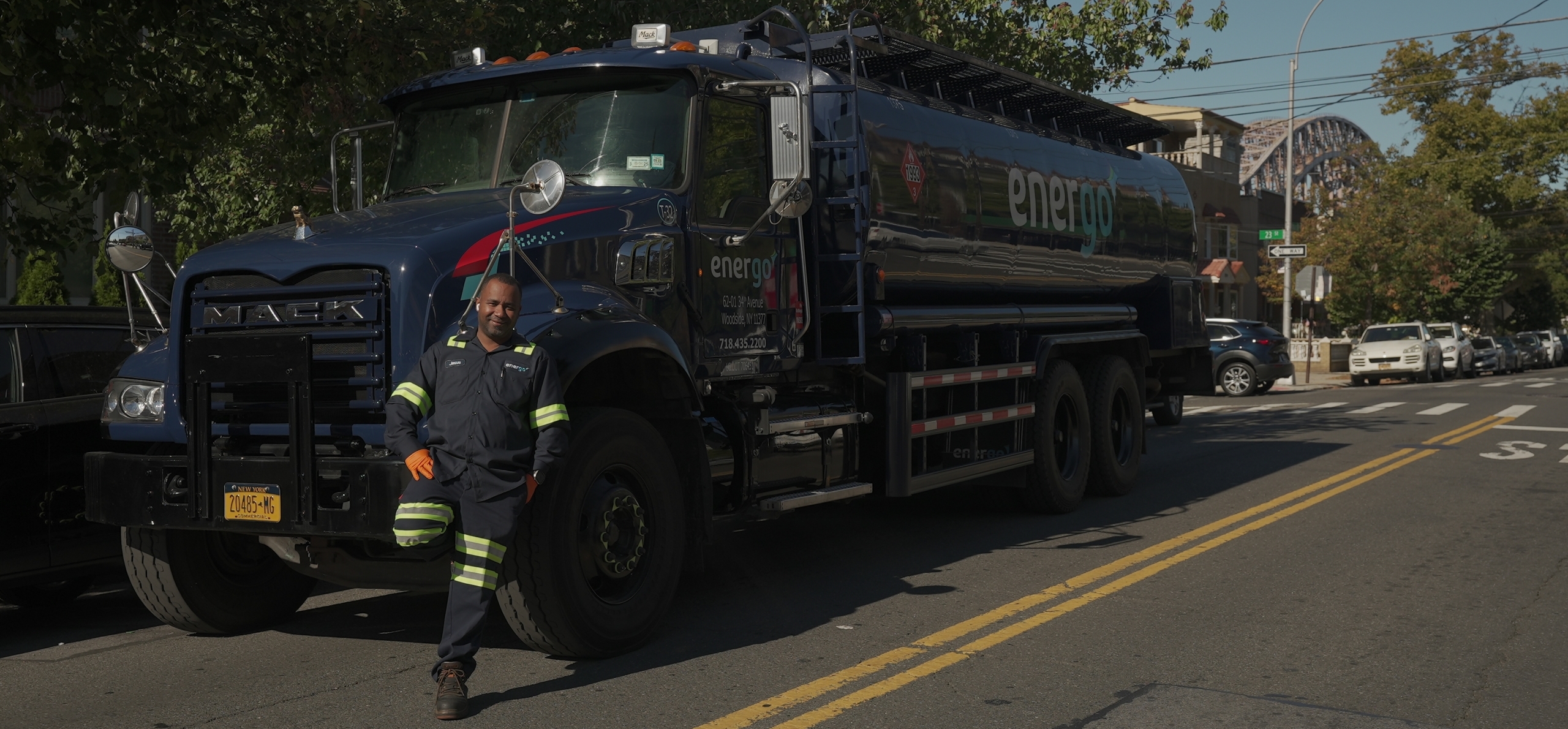 Energo service truck with driver in Brooklyn neighborhood