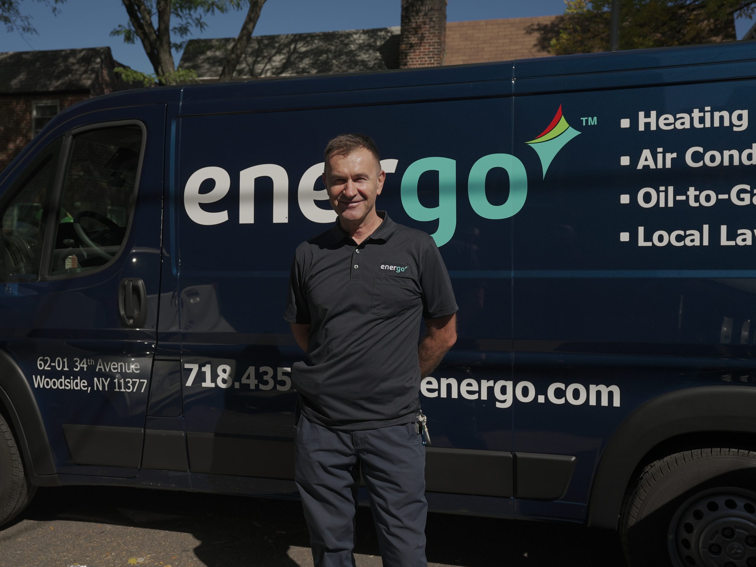 Energo van driver standing outside in Woodside, NY