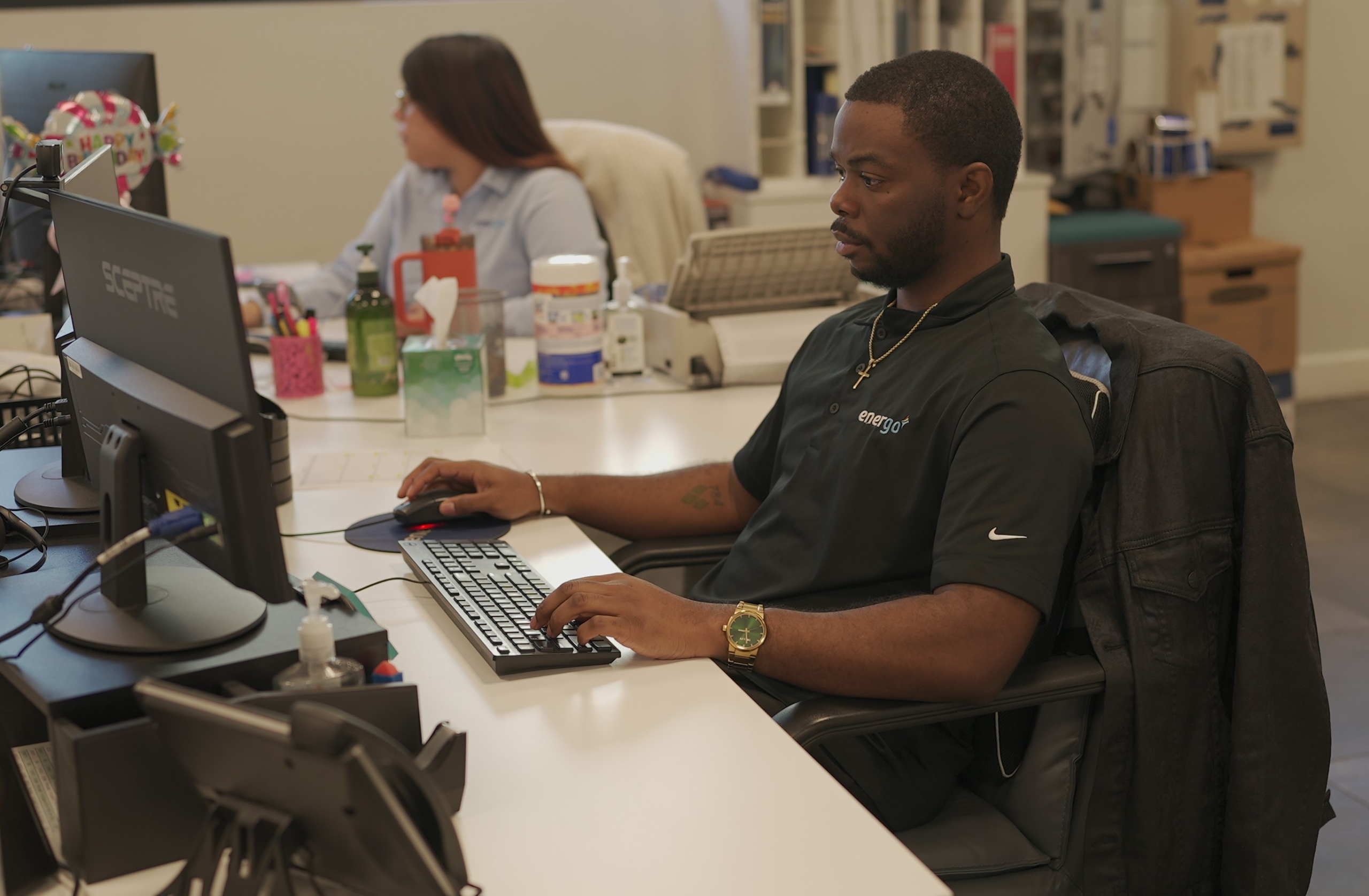 Energo employee working on desktop computer in office